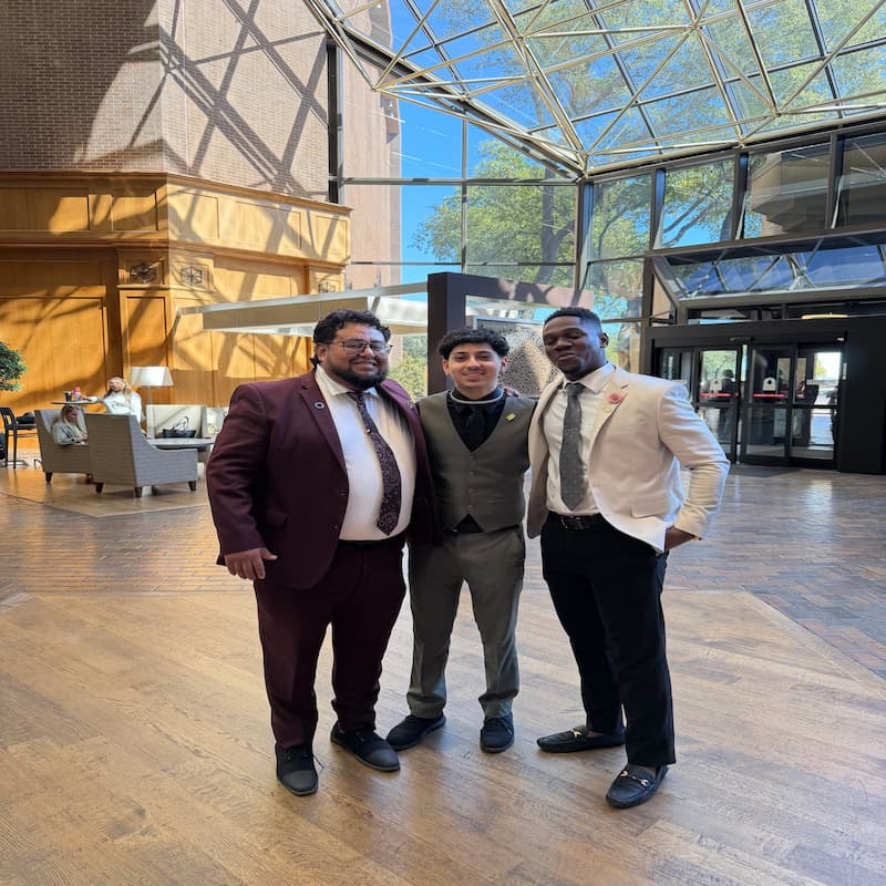 Legends Ascend Inc professionals at a business event in professional suits